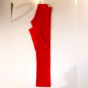Never worn Orange Red Burberry girl leggings size 10y